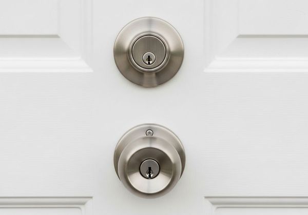 Installing a new brushed nickel deadbolt on a wood door
